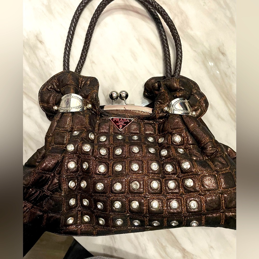 Copper color knock off Prada handbag.